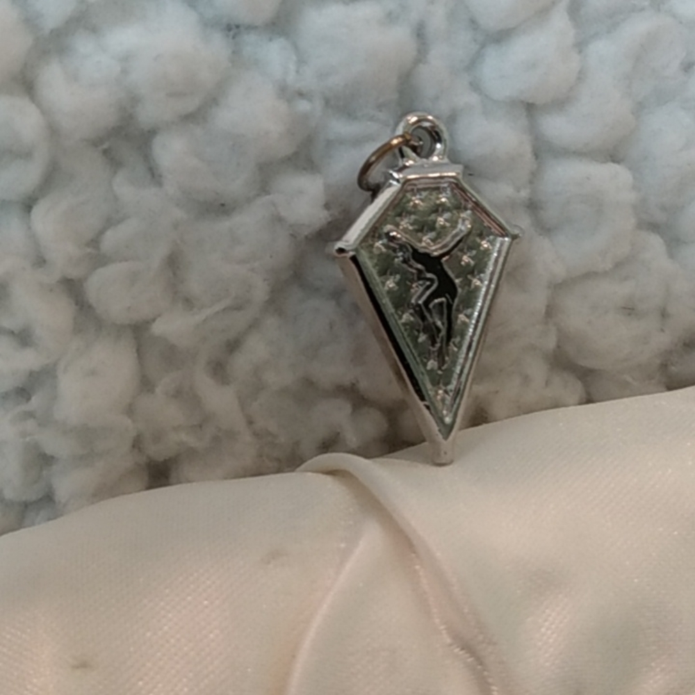 Silver tone spear pendant
